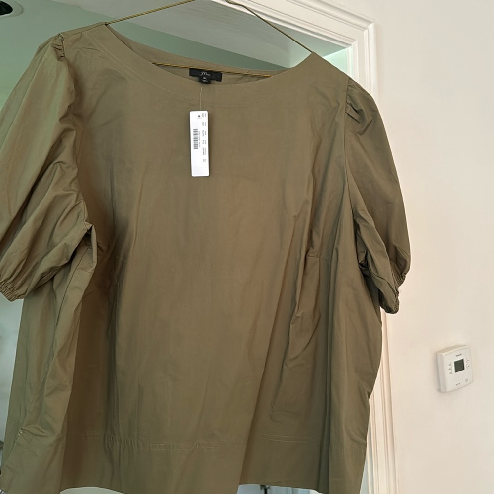 New with Tags. J Crew Top. Cute puff sleeves. Great vented back.